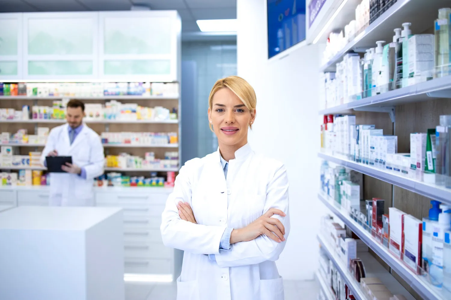 Pharmacist standing in a pharmacy offering prescription and medication services in Jacksonville.