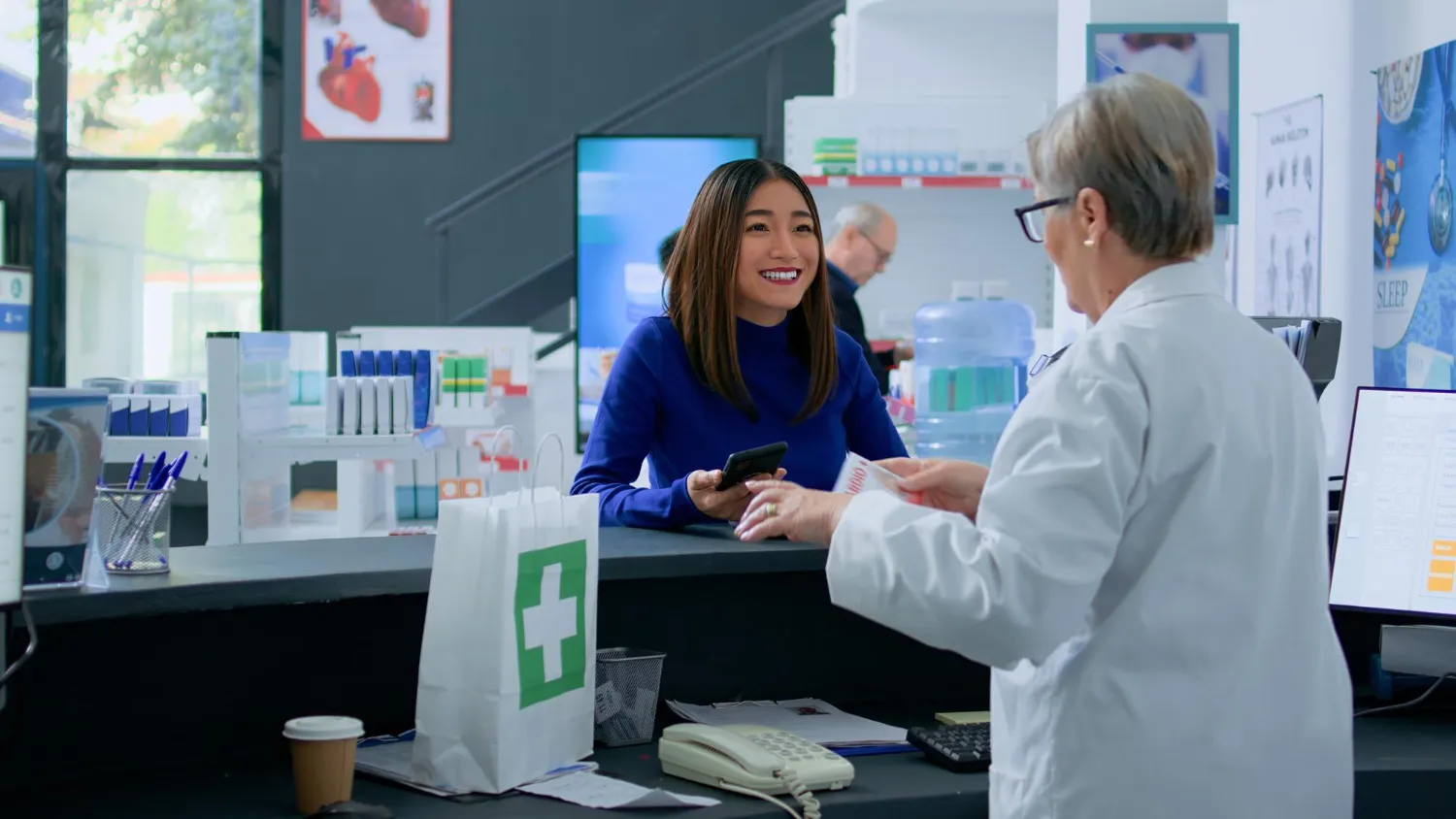 Patient consulting with a pharmacist about clinical pharmacy services, medication management, prescription optimization, and personalized healthcare support