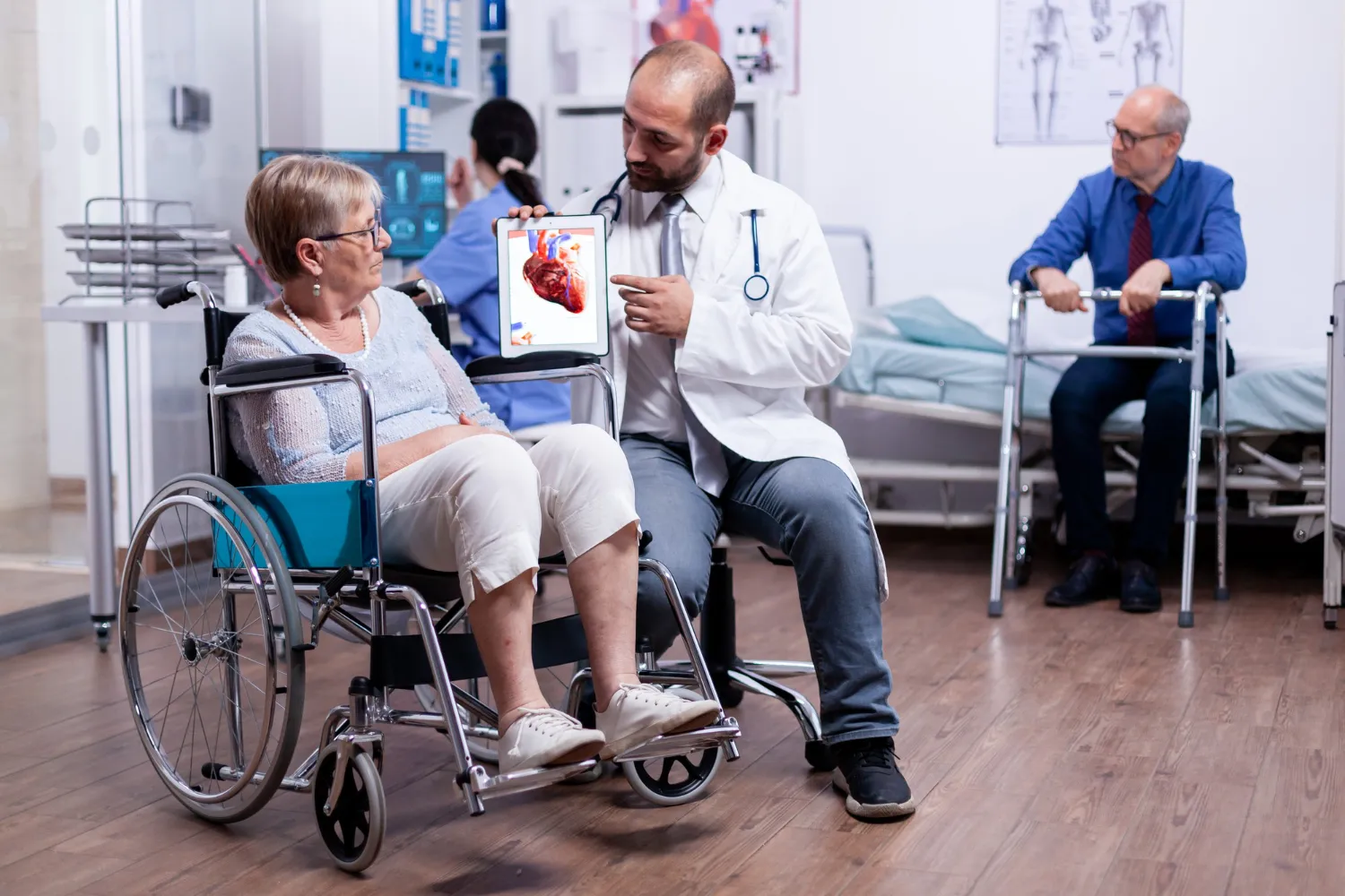 Doctor consulting patient in wheelchair using durable medical equipment at medical supply store in Jacksonville
