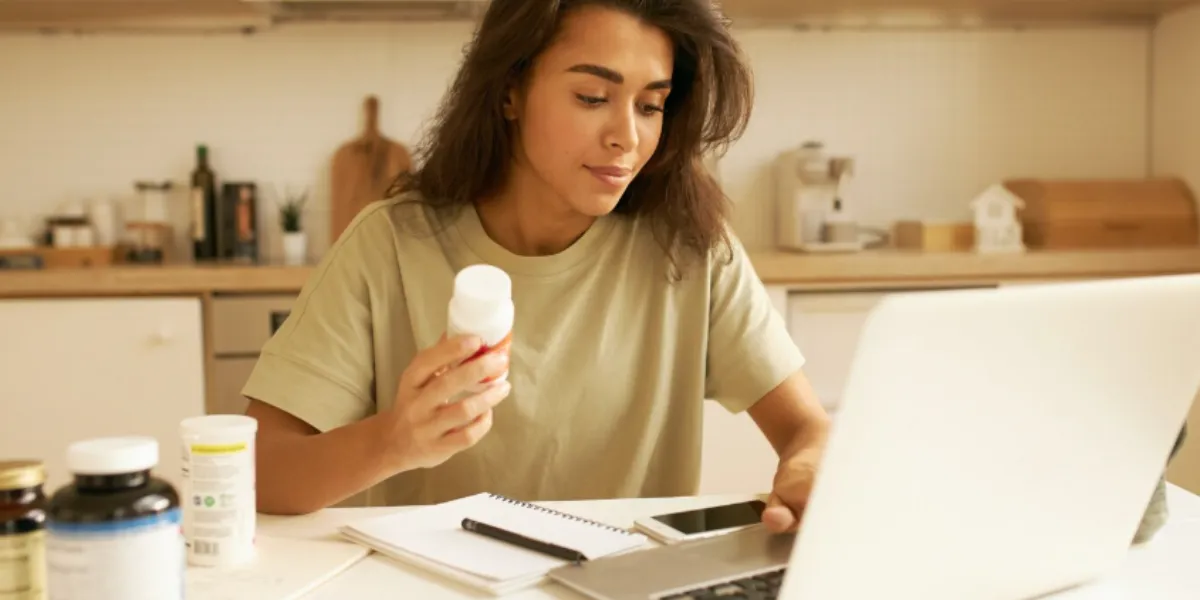 Patient using telehealth pharmacy services to manage medications and receive online pharmacist support