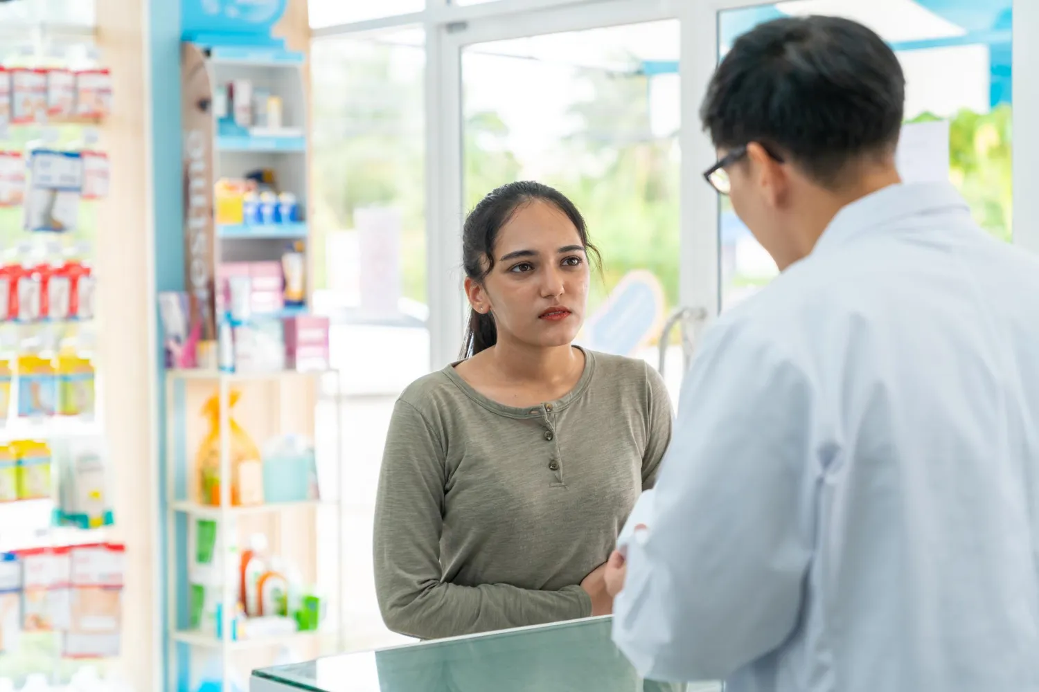 Pharmacist consulting with a patient, highlighting patient management and pharmacy services that improve adherence, provide counseling, and enhance overall treatment outcomes