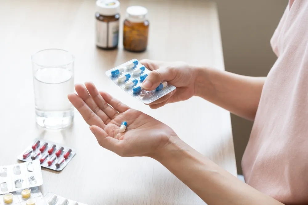 Image showing a pharmacy healthcare environment where professionals provide prescription services and patient counseling