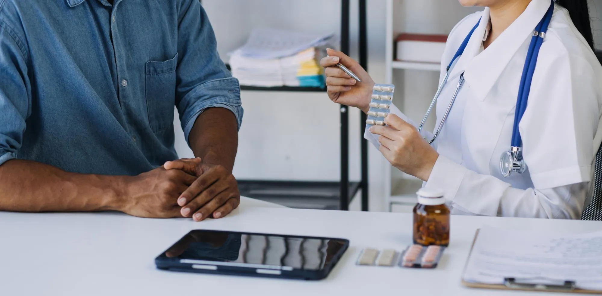 Clinical pharmacist providing Clinical Pharmacy Services by reviewing medications with a patient, performing a Comprehensive Medication Assessment, and recommending personalized treatment improvements.