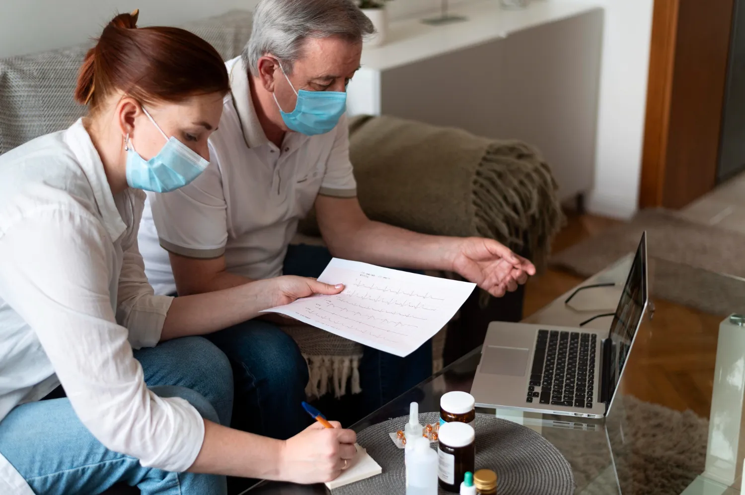 Caregiver reviewing medical instructions with an older adult during a home visit, demonstrating how DME medical supplies and home healthcare equipment help patients recover safely at home in Jacksonville, FL.