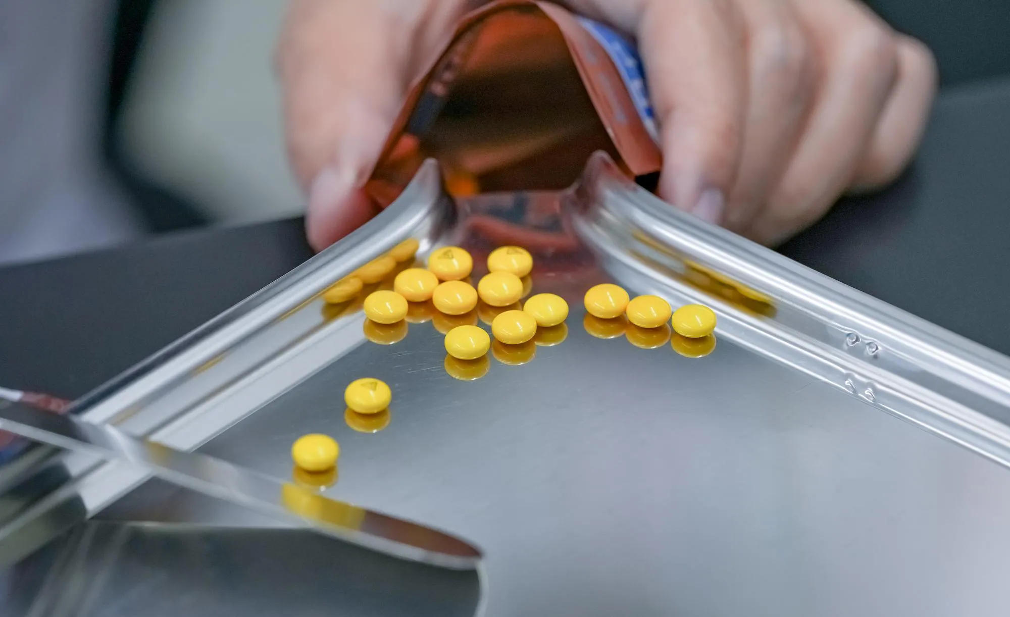 Pharmacist preparing medications for a medication synchronization service.