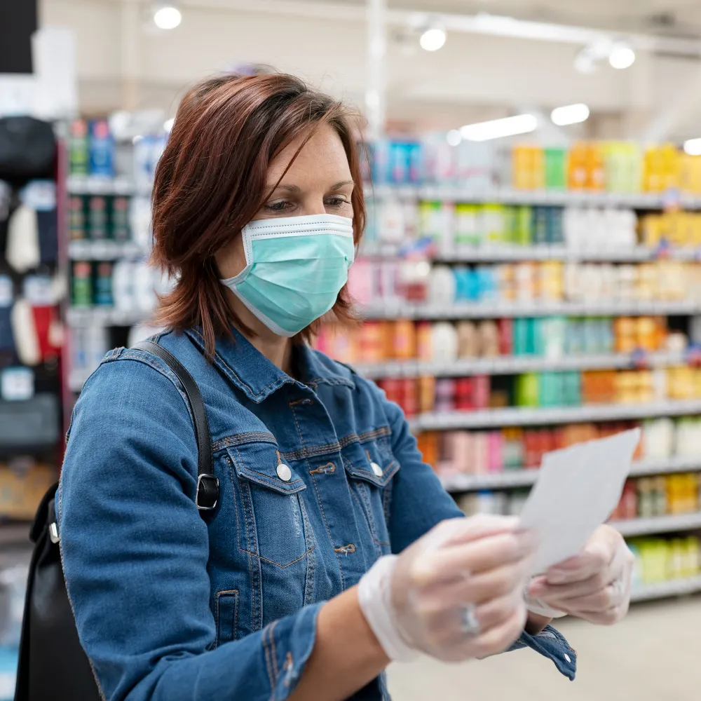 A pharmacist reviewing medication information in a pharmacy, representing prescription management, medication availability, and reliable service from a Pharmacy In Jacksonville Florida.