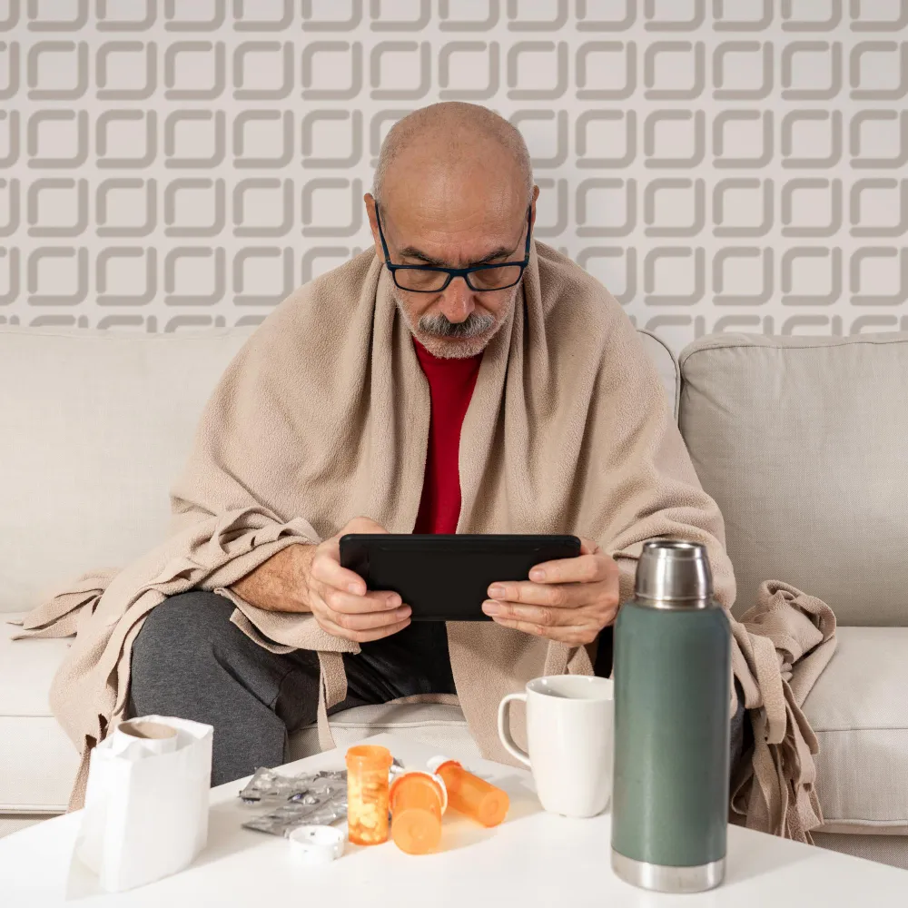 Older adult managing multiple medications at home for a medication synchronization service.